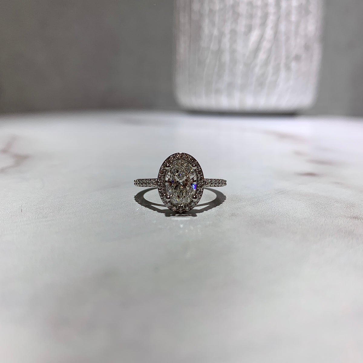 Classic oval diamond halo engagement ring