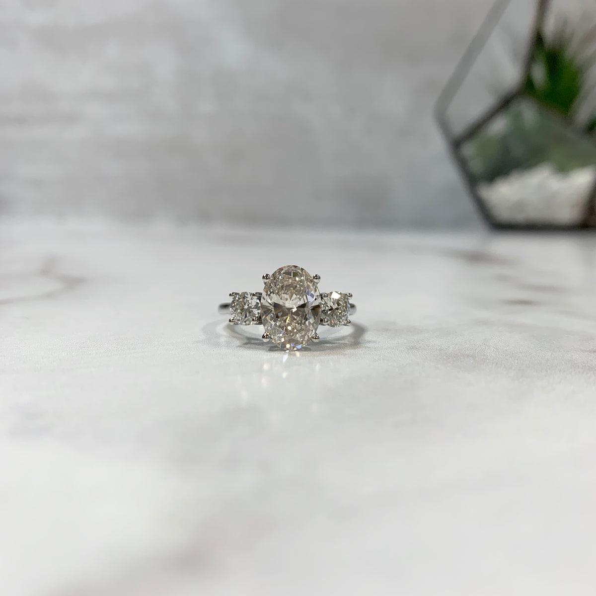 Three stone two-carat oval ring