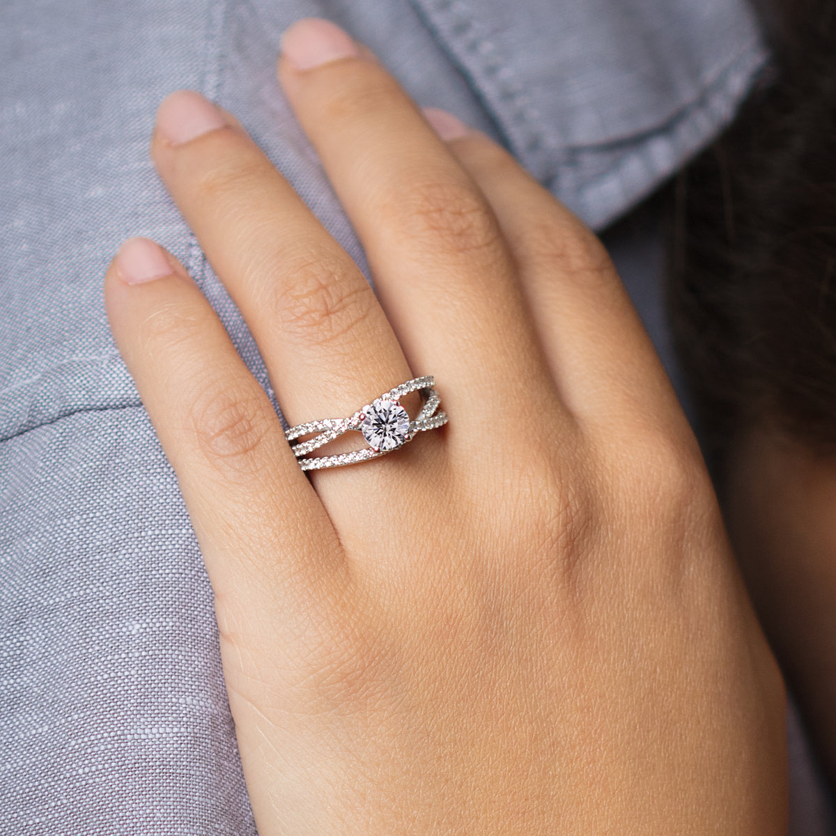 Multi band three row band engagement ring on hand close up