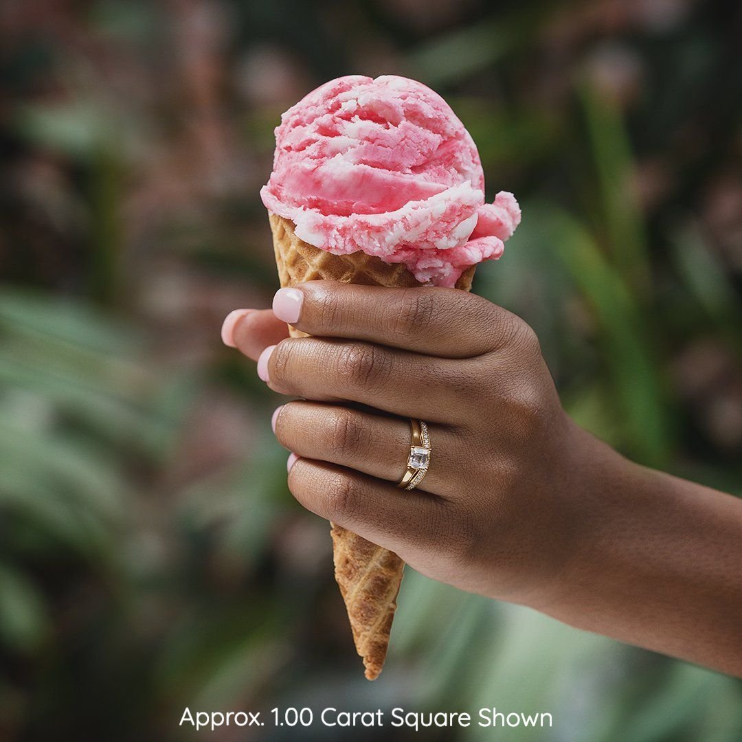 yellow gold cathedral solitaire on hand holding ice cream cone