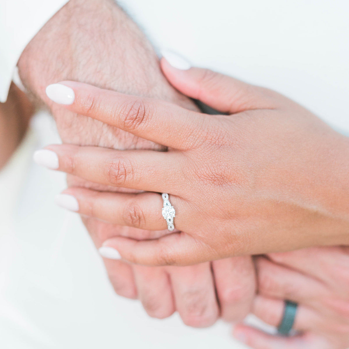 infinity inspired engagement ring on hand